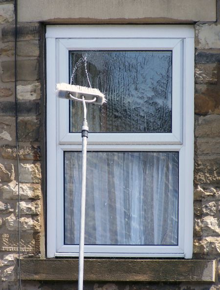 Window Cleaning for Two-Story Homes: Safer Alternatives to DIY Ladders